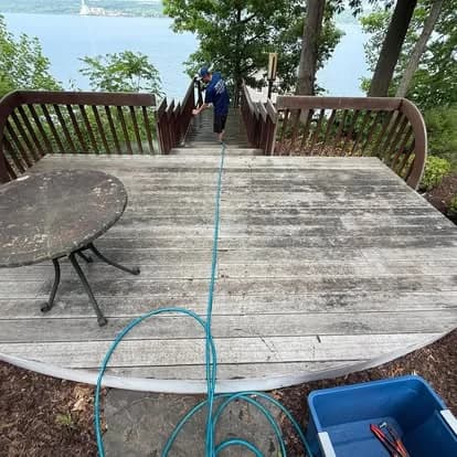 Deck before cleaning, showing dirt, algae, and weathered wood