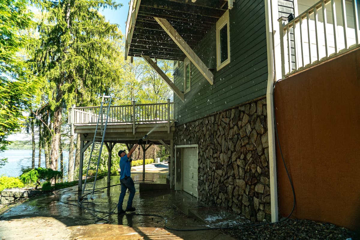 Six Mile crew working on a lakefront deck at a premium 6,500 square foot home on Cayuga Lake in Trumansburg