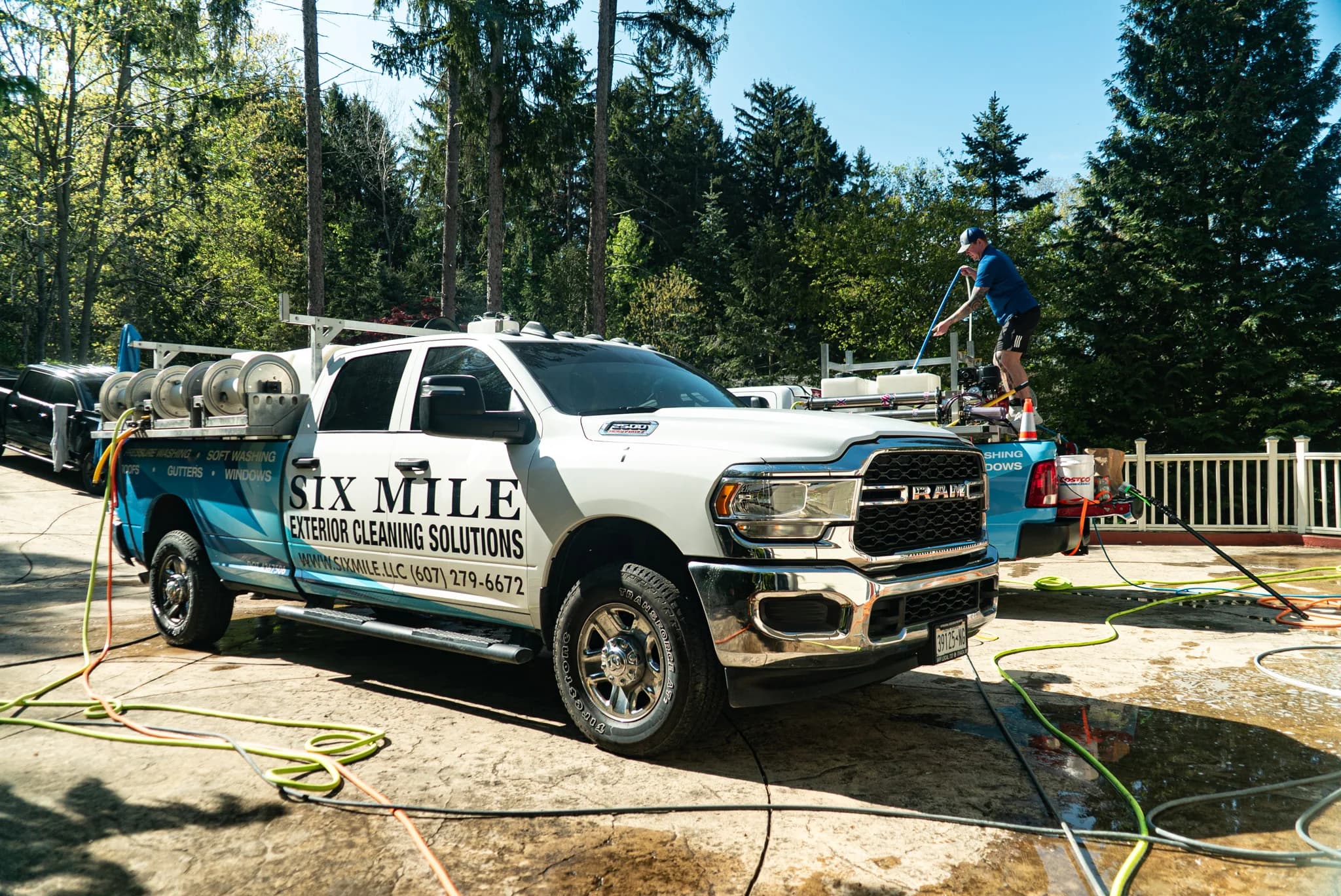 Six Mile branded truck and crew on a job site near Trumansburg