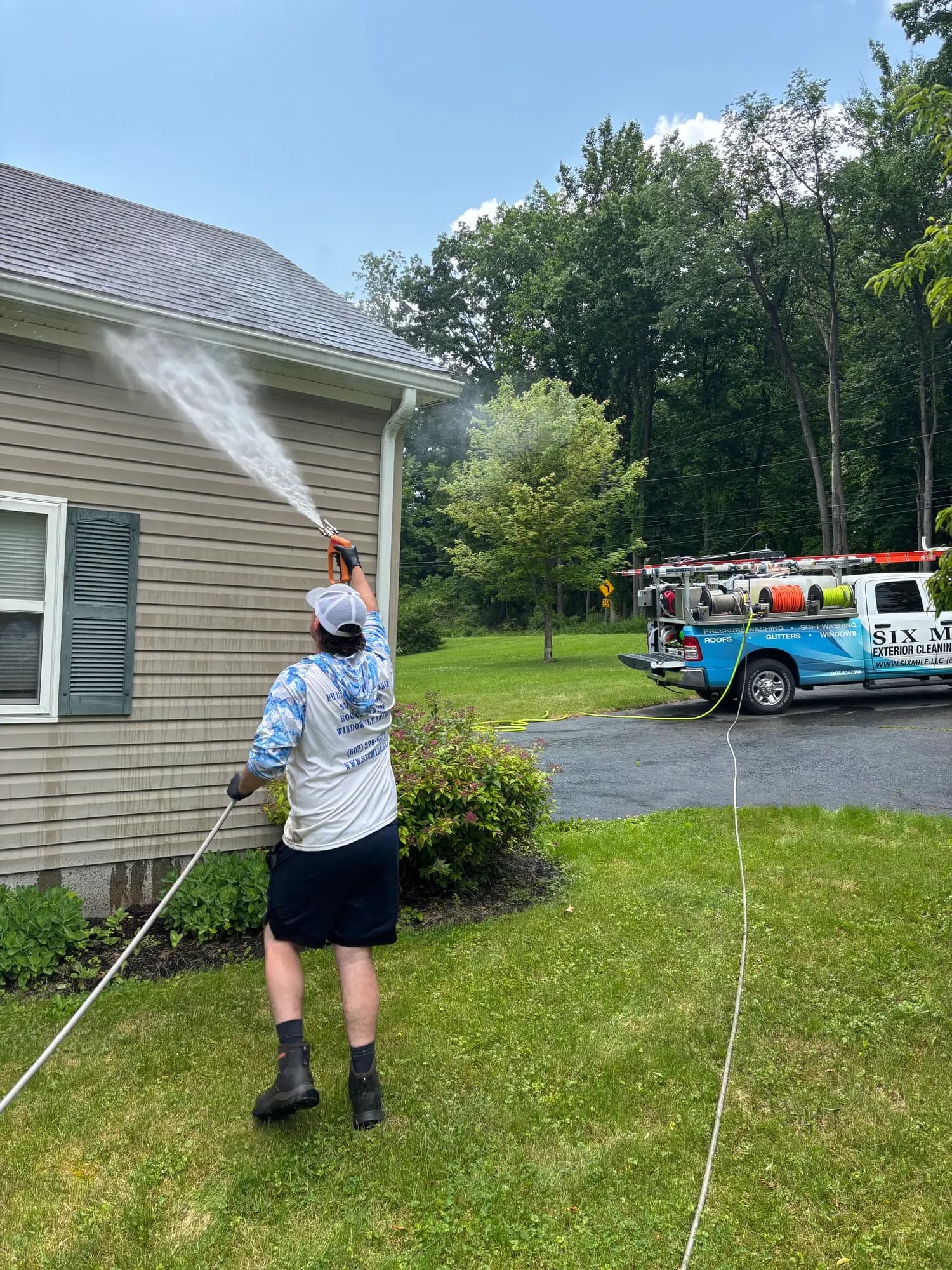 Six Mile technician soft washing house exterior